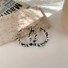 Load image into Gallery viewer, B/W leather hoops
