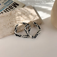 Load image into Gallery viewer, B/W leather hoops
