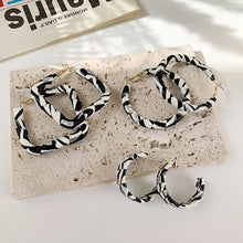 Load image into Gallery viewer, B/W leather hoops
